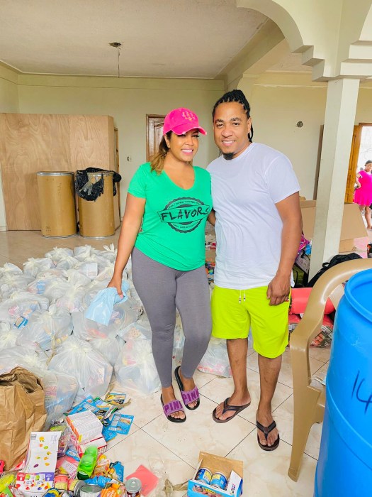 Keren Espinoza and her fiance Richard during one of their distribution events in Haiti.