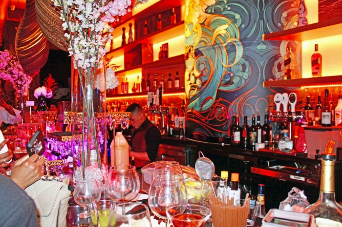 The vast drinks bar with paintings of Asian flowers on the wall, serves a variety of beverages.