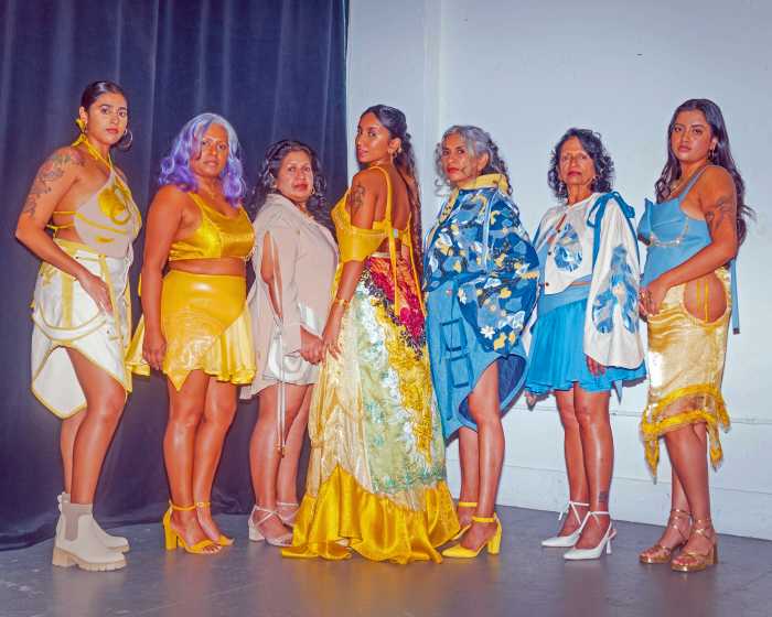 Jasmin Nessa Ali (center) surrounded by models wearing pieces from her clothing branding NESSA.