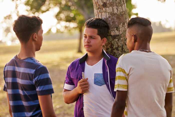 Kids smoking electronic cigarettes.