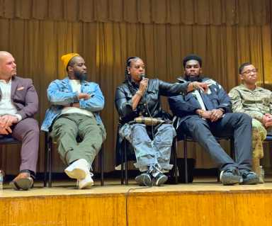 Sharnell Ellerby, owner of Queen Divas Body Sculpting & Esthetics Academy, speaks on the panel to students at Olympus Academy's Career Day.