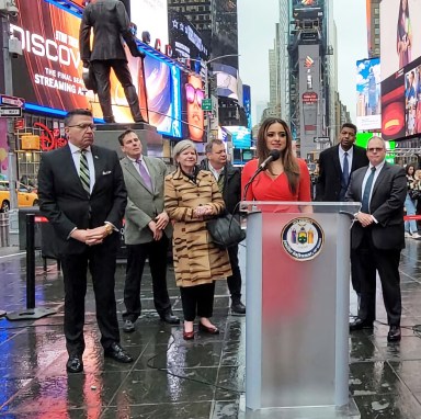 Assemblywoman Jenifer Rajkumar addresses 'Smotke Out' rally at Times Square.
