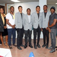 James Cordice, coordinator of the Belize and St. Vincent and the Grenadines Penn Relays initiative, right; Kylla Herbert, coordinator of the St. Kitts and Nevis initiative, second from right; SVG Consul General Rondy "Luta" McIntosh, far left; and Belize officials and athletes at a reception for Belizean, Vincentian and Kittitian teams that competed in the Penn Relays Carnival, at the Calabash Restaurant and Lounge on Lancaster Avenue in Philadelphia.