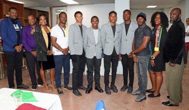 James Cordice, coordinator of the Belize and St. Vincent and the Grenadines Penn Relays initiative, right; Kylla Herbert, coordinator of the St. Kitts and Nevis initiative, second from right; SVG Consul General Rondy "Luta" McIntosh, far left; and Belize officials and athletes at a reception for Belizean, Vincentian and Kittitian teams that competed in the Penn Relays Carnival, at the Calabash Restaurant and Lounge on Lancaster Avenue in Philadelphia.