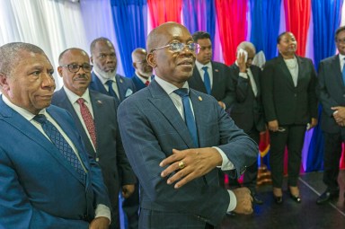 Michel Patrick Boisvert, center, who was named interim Prime Minister by outgoing Prime Minister Ariel Henry, attends the swearing-in ceremony of the transitional council tasked with selecting Haiti's new prime minister and cabinet, in Port-au-Prince, Haiti, Thursday, April 25, 2024. Boisvert was previously the economy and finance minister.