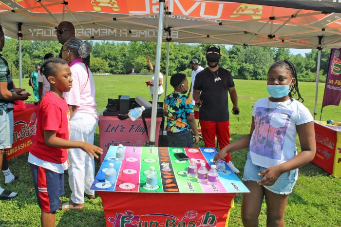 Campers enjoy a board game in Canarsie Park, Brooklyn to start a previous Summer Series Workshop, as part of the Guyana Folk Festival calendar of events.