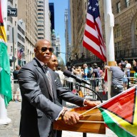 Mayor Eric Adams, next to First Deputy Commissioner Tania Kinsella, addresses a large audience at Guyana's 58th Independence Anniversary at Bowling Green, NYC, on May 24.