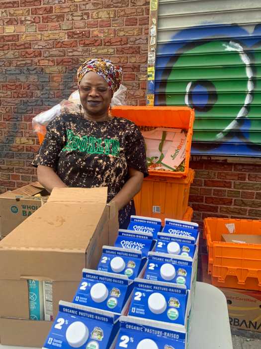 Jamaican born Naeemah Senghor preparing to distribute food to the needy.