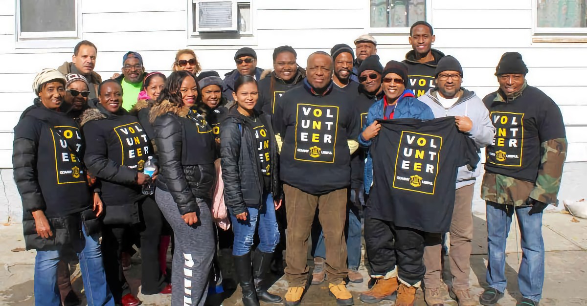 Some members of the Queens College Guyana Alumni Association, New York are pictured with Tony Singh, extreme right, during a past Thanksgiving meal distribution at Singh's Calvary's Mission Food Pantry in Queens.