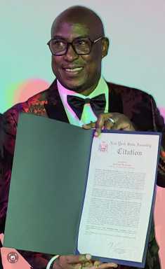 Richard "Richie B" Burgess, a veteran broadcaster with almost 30 years experience, presented with a proclamation in September 2022 by Brooklyn Assemblyman Brian Cunningham, representative for the 43rd Assembly District in New York.