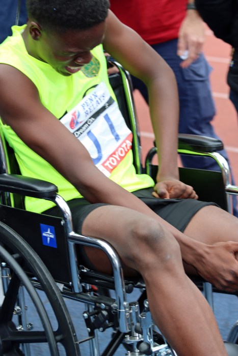 Injured Leemore Ollivierre in a wheel chair.