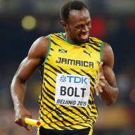 Jamaica's Usain Bolt smiles as Jamaica wins the men's 4x100m relay final at the World Athletics Championships at the Bird's Nest stadium in Beijing, Saturday, Aug. 29, 2015.