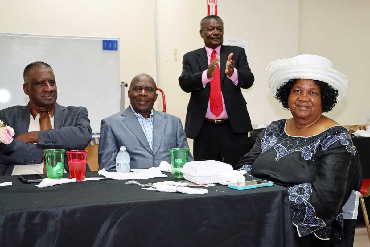 Pastor the Rev. Ronald Bailey, standing, with some members of the clergy at the Prayer Breakfast.