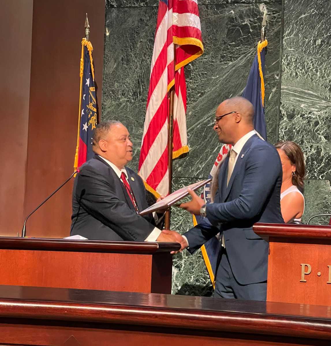 Atlanta Councilman Michael Julian Bond presents the award to Albert “Al” Ely Edwards’s son, Jason K. Edwards.