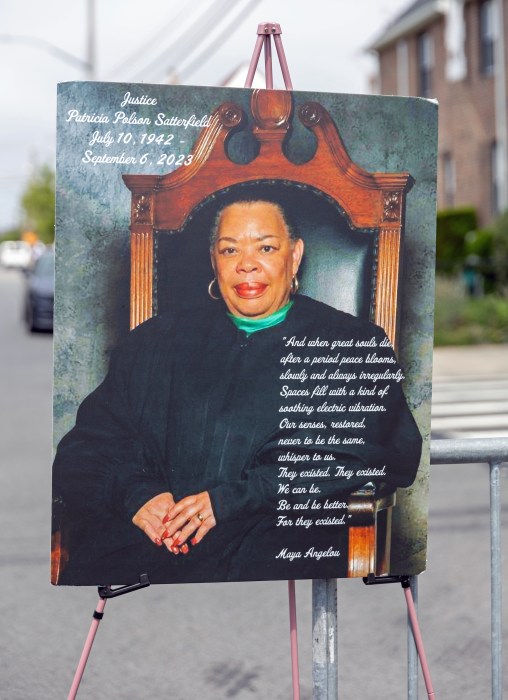 A poster displays the image of Justice Patricia P. Satterfield.