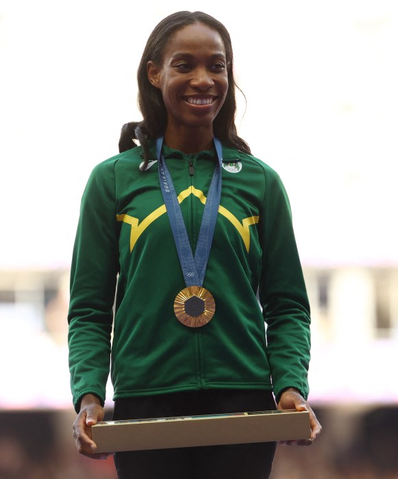 Paris 2024 Olympics - Athletics - Women's Triple Jump Victory Ceremony - Stade de France, Saint-Denis, France - August 04, 2024. Gold medallist Thea Lafond of Dominica celebrates on the podium.
