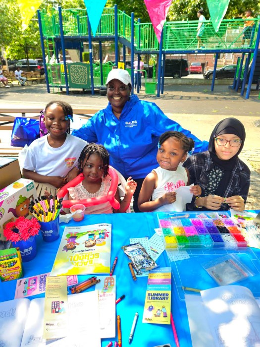 Kids enjoy a creative exercise sponsored by CABS Health Network, at Senator Kevin Parker's 17th Annual Back-to-school festival in Paerdegat Park, on Aug. 24.
