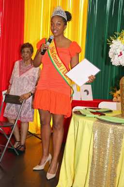Mickalia Forrester-Ewen, Miss Grenada USA addressed ceremony at Nutmeg House, with Cecily Mason, president of the Grenadian-American Ex-Teacherss Association in background.