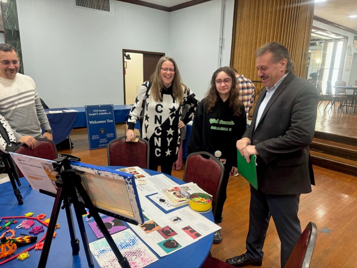 Senator Addabbo congratulates Girl Scout Brianna Rizzo on her artwork.