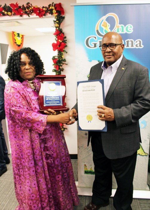 President of the Guyana America Heritage Foundation, Lady Ira Lewis, extended greetings on behalf of her organization and handed over a plaque from GAHF and a Proclamation from NJ Senator Britnee Timberlake to Consul General of Guyana to New York, Ambassador Michael E. Brotherson during a festive social at the Manhattan Consulate on Dec. 18.