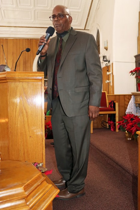 Pastor, the Rev. Roger Jackson, addresses the congregation.