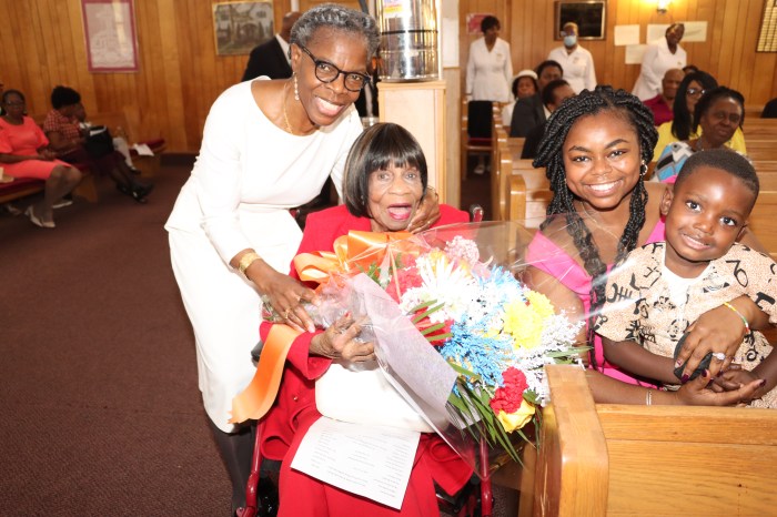 Sis. Marlene Ferguson, left, the Trinidadian-born chair of FSUMC's Family Life Committee, with Dr. Marguerite Thompson, in a wheelchair, flanked by Dr. Thompson's granddaughter Patrice Eleah and her son, Ezra George Thompson, during Dr. Thompson's 94th Birthday celebration at FSUMC on Oct. 6, 2024.