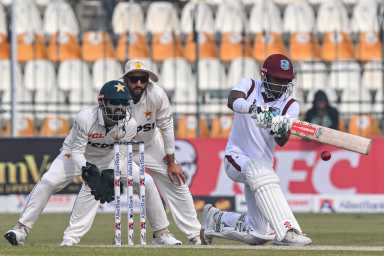 West Indies' Alick Athanaze (R) plays a shot during the third day of the first Test cricket match between Pakistan and West Indies at the Multan Cricket Stadium in Multan on Jan. 19, 2025.
