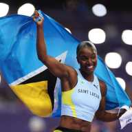 Julien Alfred of Team Saint Lucia celebrates winning the gold medal during the Women's 100m Final on day eight of the Olympic Games Paris 2024 at Stade de France on Aug. 03, 2024 in Paris, France.