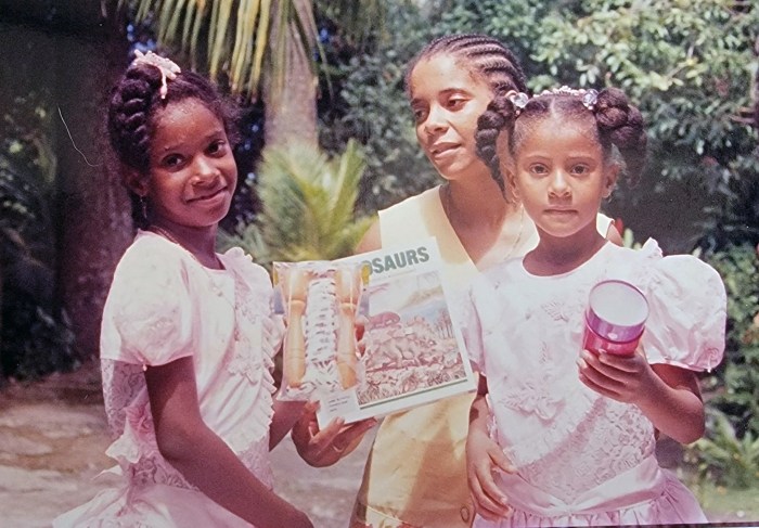 From her humble beginnings in Dominica, Rennae Francis shares a moment with her mother and sister.