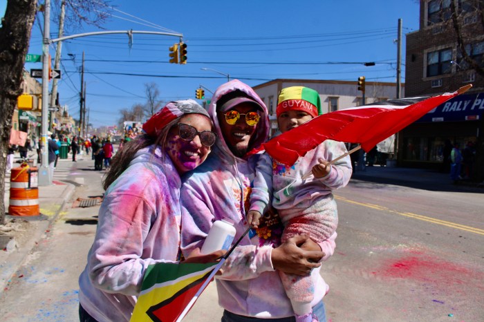 A baby with a mix of Trinidad & Tobago and Guyana heritage, enjoyed the Phagwah celebration with her parents last Sunday on Liberty Avenue in Richmond Hill, Queens.