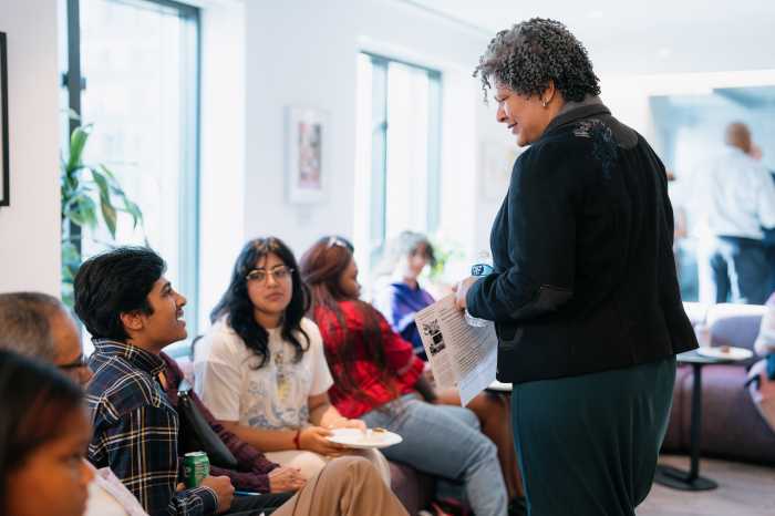 Rachel Watts leads a workshop, demonstrating her commitment to supporting educators and artists who foster creativity in students through arts education.