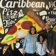 From left, Trinidad native Natalie Lamming, and Grenadian native Davis Alexander, pose with 11-year old Sebastian, owner of Spices & Slices at 1828 Nostrand Ave., Brooklyn, a Caribbean style pizzeria.