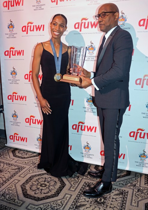 Dominican Olympian Thea La Fond-Gadson receives the Salute to Caribbean Gold Award from Dominica's Ambassador to the United Nations Dr. Philbert Aaron.