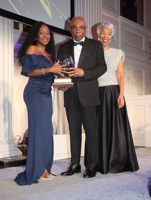 Cedric Gayle, Esq. receives Pelican Award from, left, Dr. Sheryce Woolery, City University of New York (CUNY), and Celia Davidson Francis, UWI IAD Department.