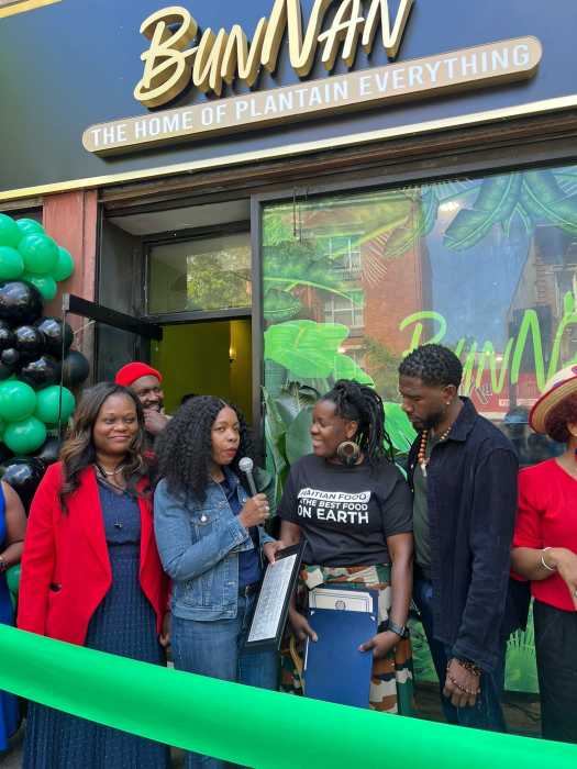 Elected officials and the community celebrating BunNan’s opening including Council Member Rita Joseph presenting a citation, Assembly Member Rodneyse Bichotte Hermelyn (left) and Public Advocaate Jumaane Williams (right).