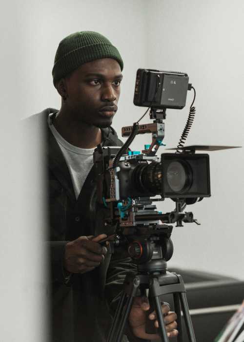 Tevin Foster, independent filmmaker and founder of Hazy Sun Productions, prepares to introduce his new documentary, “Race Vs. Culture: The Black Experience,” at the Belmore Movies and Showplace in Bellmore, N.Y.