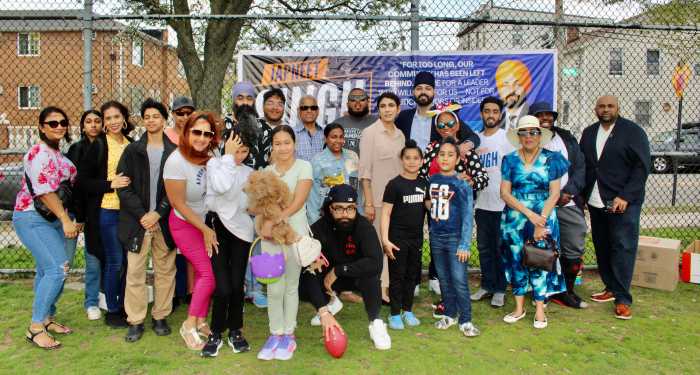Japneet Singh, candidate for New York City Council District 28, 10th from left, towering over a large group of supporters at Police Officer Edward Byrne Park, in South Ozone Park, at an Easter Egg Hunt on April 19.