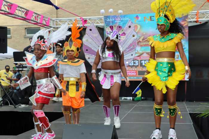 Masqueraders from Mas Productions Unlimited previews "Changes" for WIADCA Labor Day Carnival Parade.