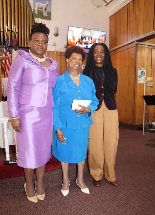 Sis. Dorothy Providence receives check from Sis. Dianne Brown, right, and Sis. Ava Providence.