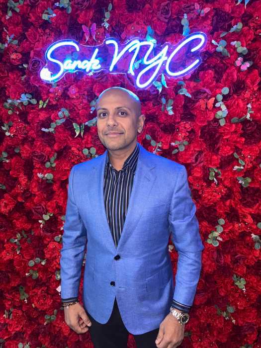 Boodram, owner of the newly reopened Sandz NYC, stands inside the upscale Caribbean fusion restaurant during a private preview night.