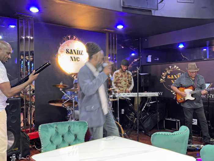 A live band, Jamaica Live, performs at Sandz NYC, part of the lounge’s promise to bring Manhattan-style sophistication with West Indian flair to Queens nightlife.