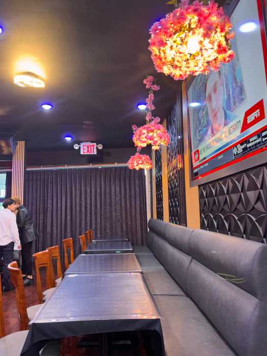 The newly renovated interior of Sandz NYC features modern aesthetics infused with Caribbean soul, creating a welcoming space for both fine dining and evening entertainment.
