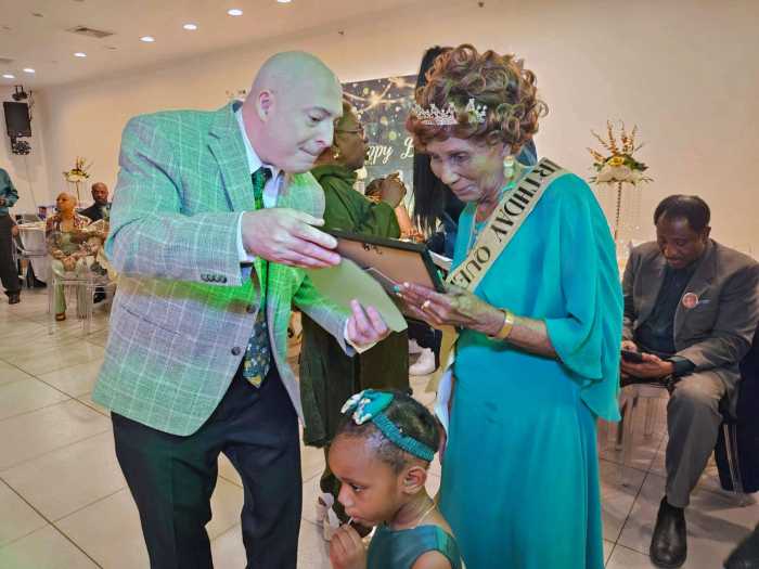 Robert, a retired technologist and friend, presented Norma Clarke with a plaque featuring rare coins created in 1930, the year she was born. Little great granddaughter, Amana Griffiths front, at a birthday soiree on May 10, in Brooklyn.