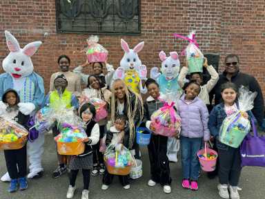 Sen. Roxanne J. Persaud with winners of prize baskets for golden eggs and raffles.