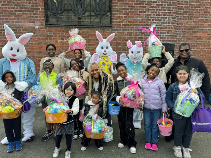 Sen. Roxanne J. Persaud with winners of prize baskets for golden eggs and raffles.