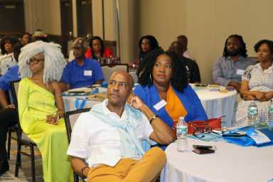 A section of the audience listening attentively during the investment forum-style event at the New York Marriott at the Brooklyn Bridge.