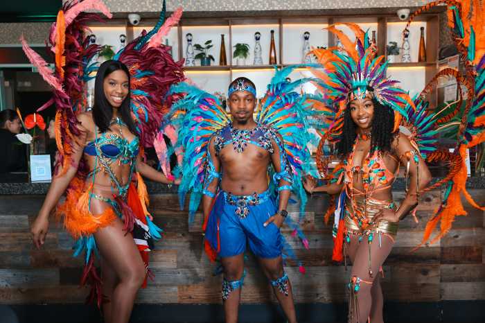 Attendees enjoy a vibrant carnival experience — complete with costume displays, dancing, and virtual reality tours of Caribbean destinations — during “Passage to Paradise,” a media event hosted by Breeze Travel Solutions as part of Caribbean Week New York.