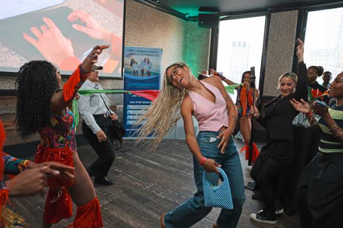 A visitor experiences a virtual journey through the Caribbean using next-generation tourism technology featured at the Breeze Travel Solutions' ‘Passage to Paradise’ event.