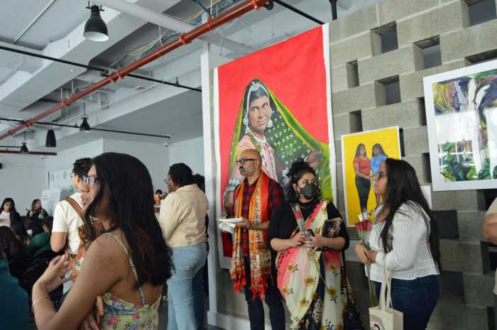 Visitors explore mixed-media installations during the Indo-Caribbean Arts Exhibition in the Bronx, part of the Oyate Group’s Caribbean Arts Series, which spotlights cultural identity and expression.