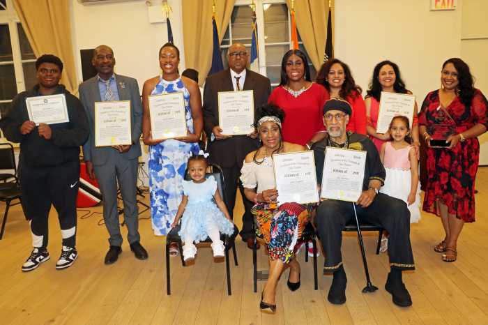 Bronx Borough President Vanessa L. Gibson, (back row, fifth from left) with honorees and family members.